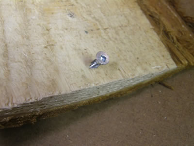 Screw in the underside of the bark