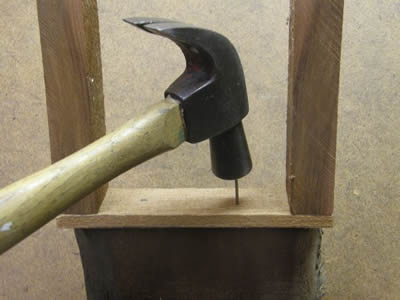 Nail to the tail piece